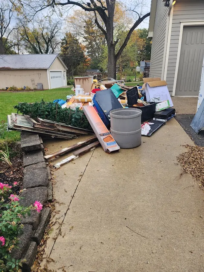 Dumpster being loaded with debris for 3 Yard Dumpster Rental in Hartsville
